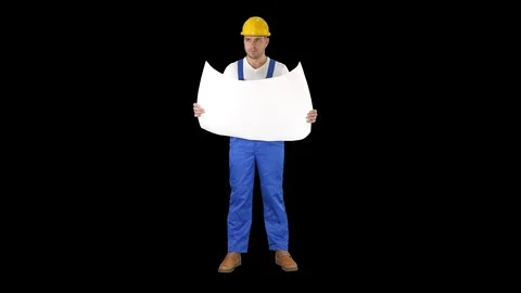 Construction worker checking blueprints on site, Alpha Channel Stock Footage 115671328