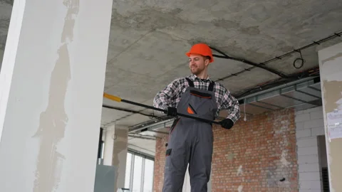 Construction worker checking ceiling with telescopic inspection mirror Stock Footage 314556635