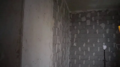 Construction worker checking wall level Stock Footage 69806899