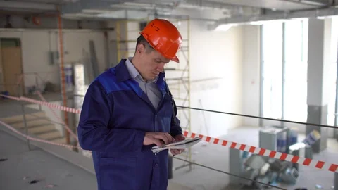 Construction worker checks the construction workflow. 4 k Stock Footage 85819954