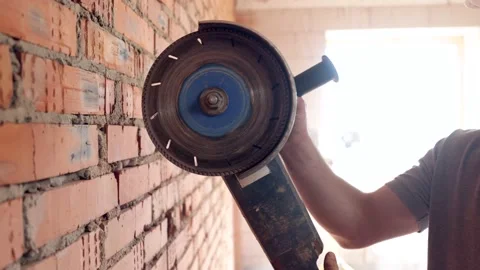 A construction worker with a circular saw in construction site. Stock Footage 160888146