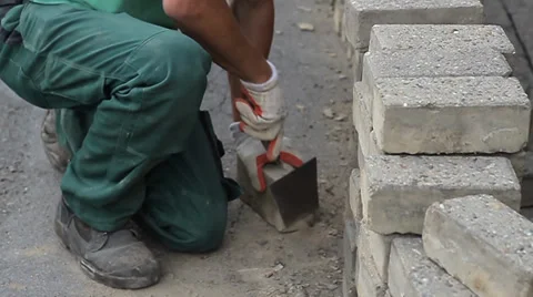 Construction worker cleaning bricks Stock Footage 34974990