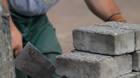 Construction worker cleaning bricks Stock Footage 34975998