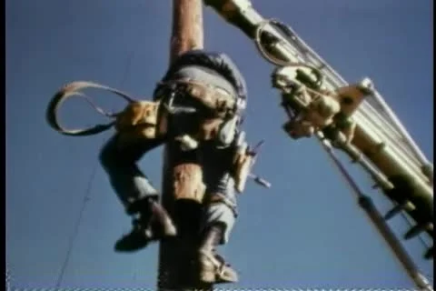 Construction worker climbing down wooden post Stock Footage 25207537