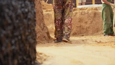 Construction worker compacting sand with vibratory tamper Stock Footage 341294779