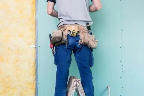 Construction worker completing the interior Stock Photos
