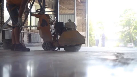 Construction worker. Concrete flooring machine Stock Footage 79657731