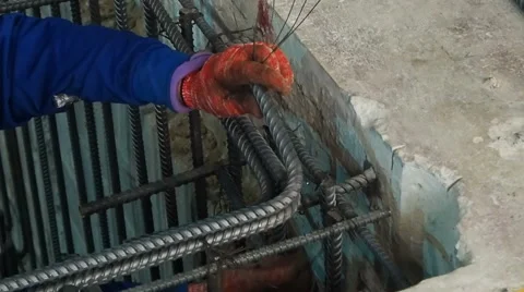 Construction worker connect reinforcement deform bar with binding wire. Stock Footage 48231249