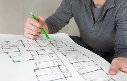 A construction worker on a construction site check documents 스톡 사진