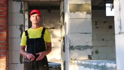 Construction worker at construction site playing with a measuring tape measure Stock Footage 161228005