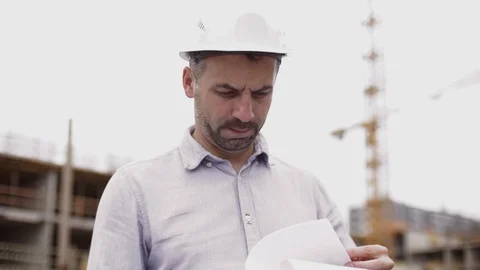 A construction worker control a pouring concrete pump on construction site and Stock Footage 111485639