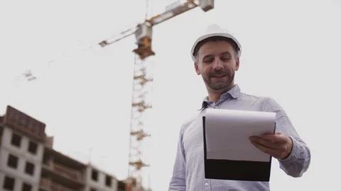 A construction worker control a pouring concrete pump on construction site and Stock Footage 111487161