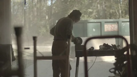 Construction worker cuts into concrete in a garage Stock Footage 144293861