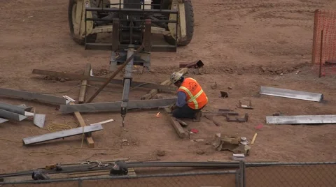 Construction worker cuts metal with a torch Stock Footage 48827102