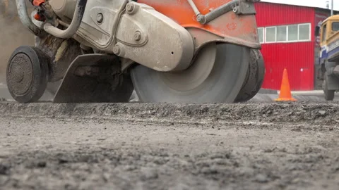 Construction worker cutting Asphalt paving stabs for sidewalk, close up 動画素材 141192995