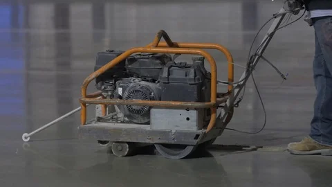 Construction Worker Cutting Concrete with Large Concrete Saw Video stock 101390342