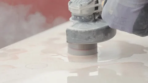 Construction worker cutting holes in tiles with a power tool. Professional Vídeo Stock 344058413