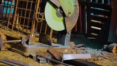 A construction worker is cutting an iron bar after measuring the perfect size wi Video stock 321859722