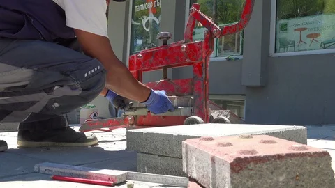 Construction worker cutting paving slabs at the street Stock Footage 89451689