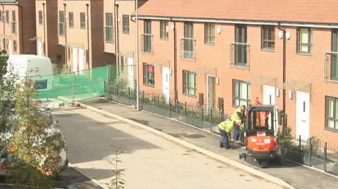 Construction worker cutting tarmac path Stock Footage 10687523