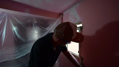 Construction worker demolishing a window frame with a chisel Stock-Footage 347640726