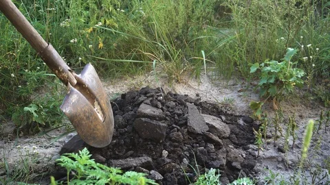 Construction worker digging broken asphalt with shovel  at road construction Video stock 94943803