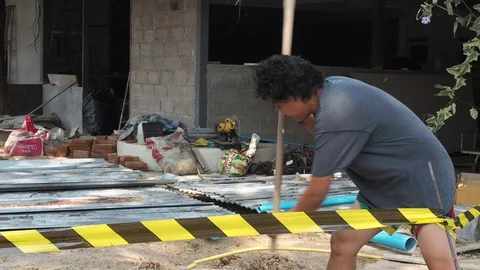 Construction worker is digging the soil with a hoe. Stock Footage 126646415