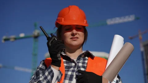 A Construction Worker diligently operating on site while engaging in radio  Stock Footage 311859819