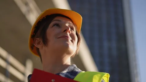  A construction worker diligently working on a site while wearing essential safe Stock Footage 311863009