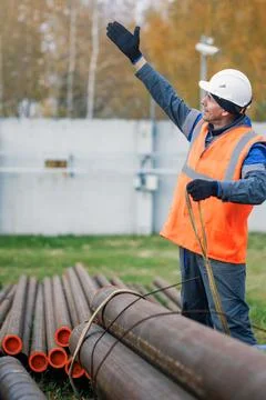 Construction Worker Directing Operations at a Job Site Stock Photos