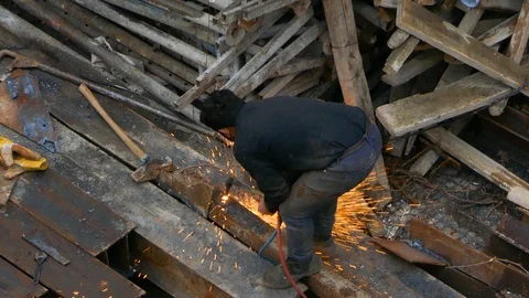 Construction worker doing oxygen acetylene welding cutting torch without mask Stock Footage 96131363