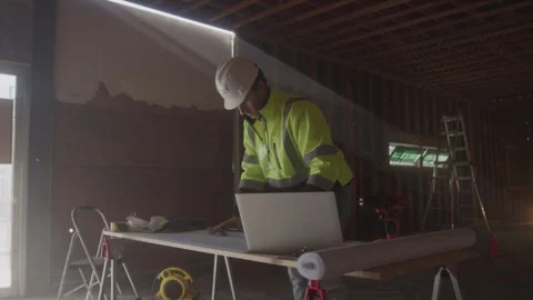 Construction Worker Drawing At Desk On Job Site Vídeo Stock 270388674