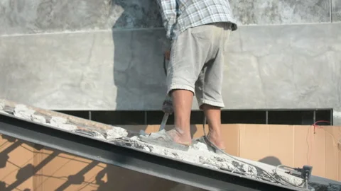 The construction worker is drilling the floor. Construction technicians use elec Stock Footage 238909428