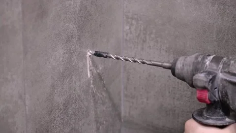 Construction worker drilling hole in Stock Video Pond5