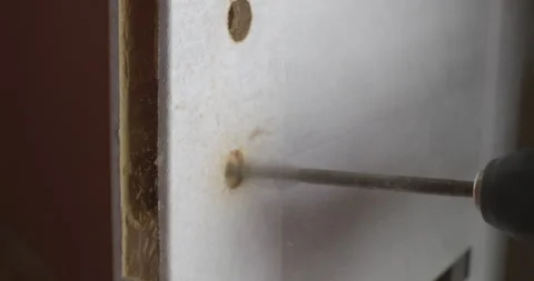 Construction worker drilling holes in a door frame Stock Footage 305651161