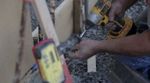 Construction worker drilling a screw Stock Footage 63916942