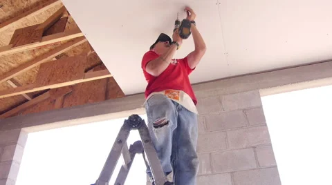 Construction worker drilling in srews Video stock 40375630