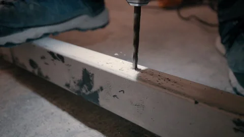A construction worker drills a steel beam. 스톡 동영상 321283363