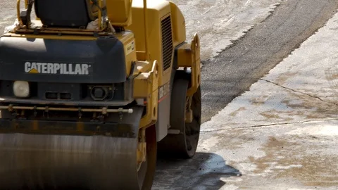 Construction worker driving asphalt roller close up Stock Footage 106365018