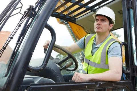 Construction Worker Driving Digger Stock Photos