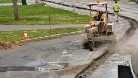 Construction worker driving street sweeper Stock Footage 106364952