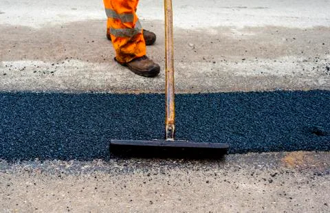 Construction Worker during Asphalting Road Works.