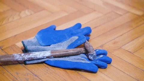 Construction Worker At The End Of His Shift Placing Down His Gloves And Hamme Stock-Footage 85399621