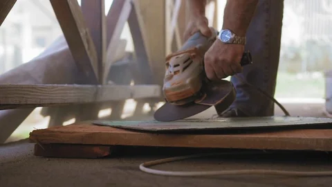 Construction worker is ending to use a grind and admiring the result. A man is Stock Footage 90429894