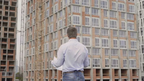 Construction worker, engineer, studying the plan,site 4K Stock Footage 111930223