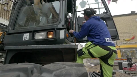 Construction worker enters digger 1 Video stock 134657286
