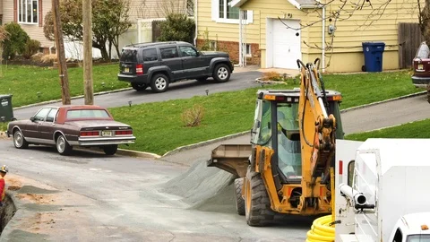 Construction worker exiting front loader Stock Footage 106365290