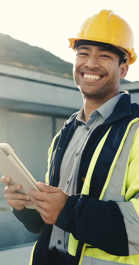 Construction worker, face and man with tablet, building site and laugh with Stock Footage 345572257