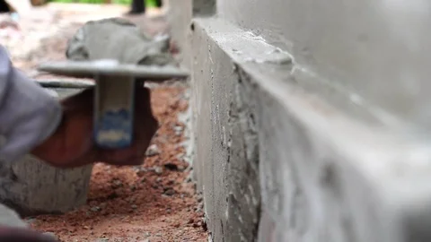 Construction worker finishing a wall  Stock Footage 112946323