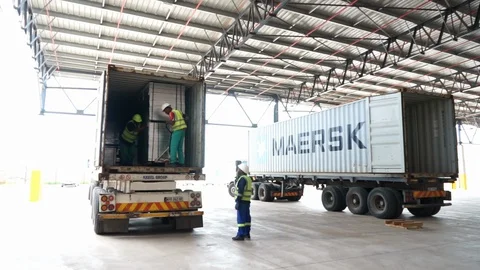 Construction worker in forklift truck unloading cargo Stock Footage 143774275